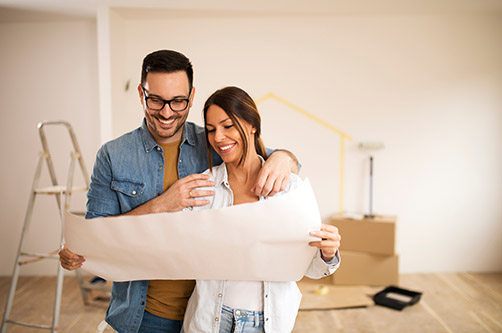 couple looking at home renovation plans